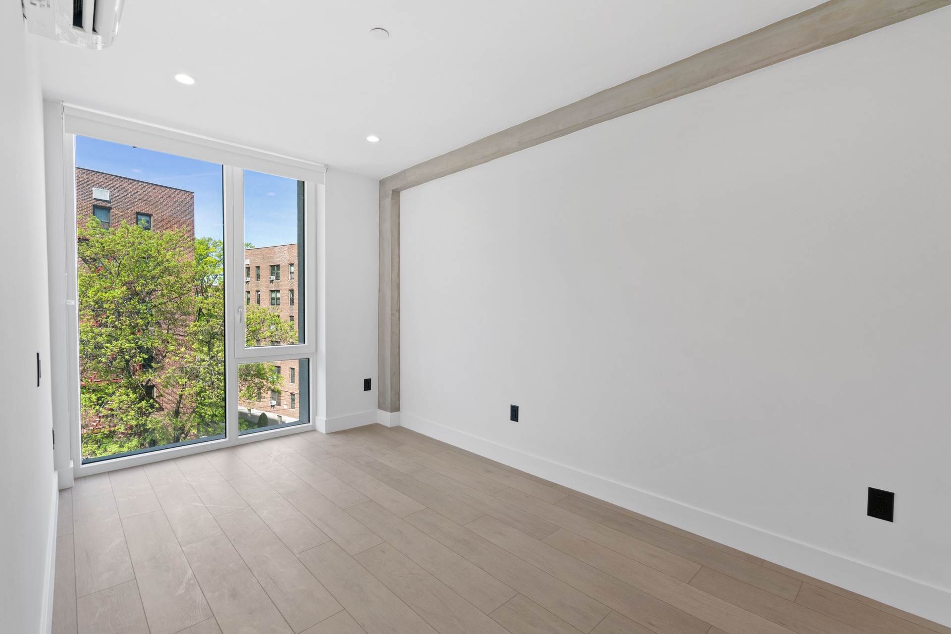 33-25 Junction Boulevard, Unit 4A Queens, NY 11372 - Photo 4 of 11 a view of an empty room with a window