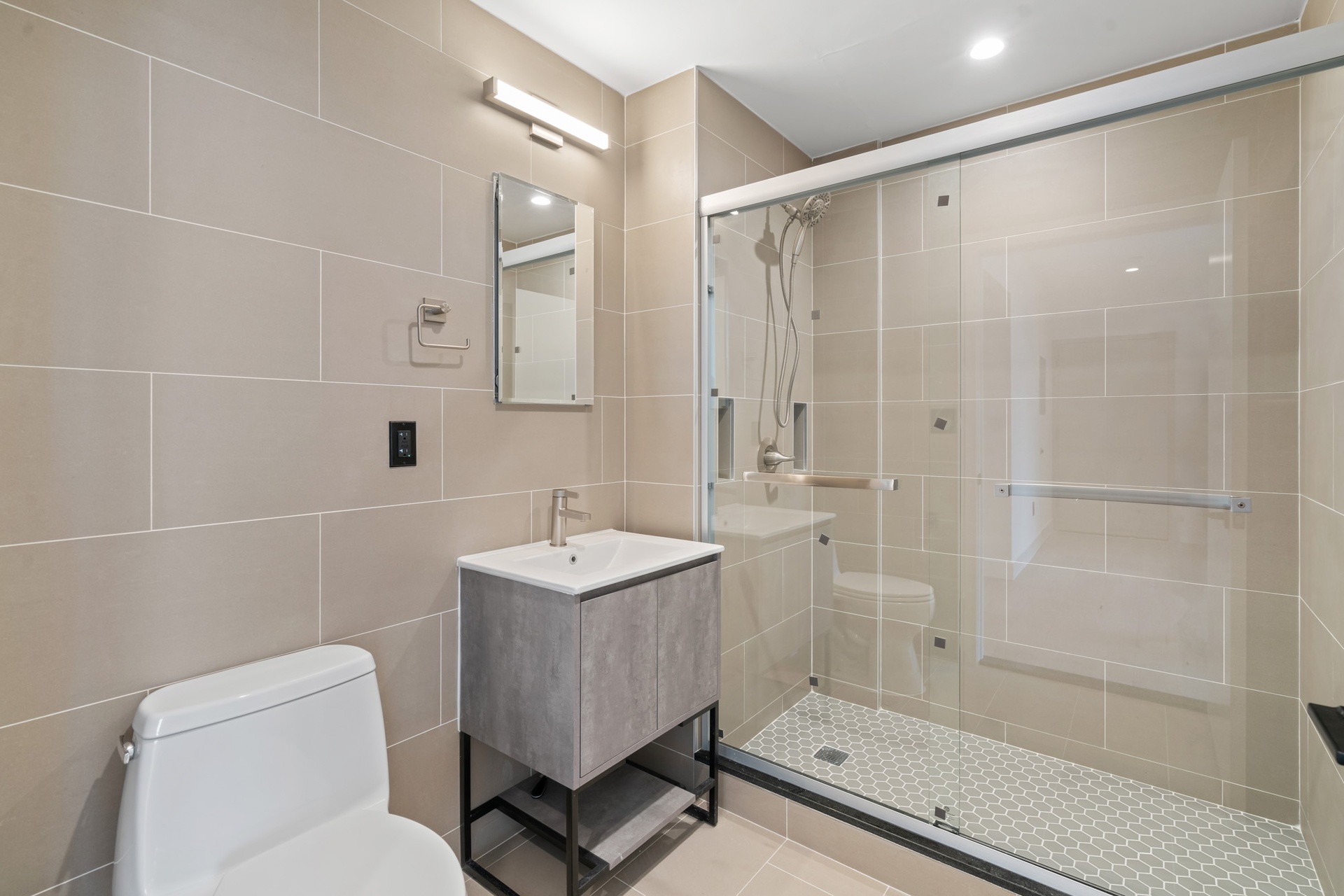 33-25 Junction Boulevard, Unit 4A Queens, NY 11372 - Photo 6 of 11 a bathroom with a shower a toilet and sink