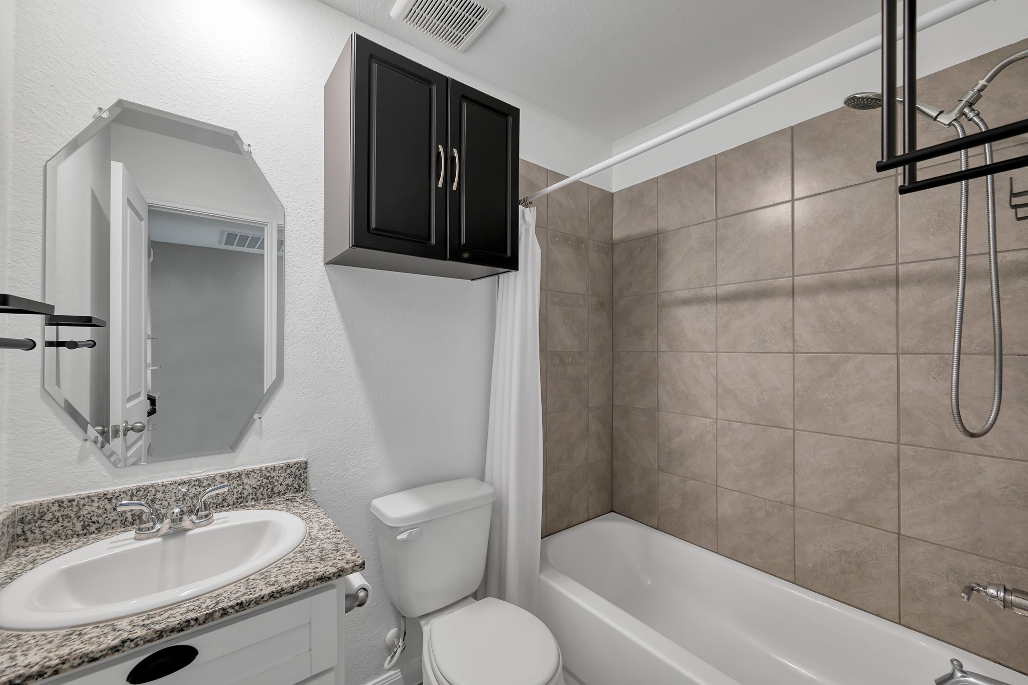 16399 Jasmine Marie Place Conroe, TX 77306 - Photo 15 of 22 a bathroom with a granite countertop sink toilet and shower