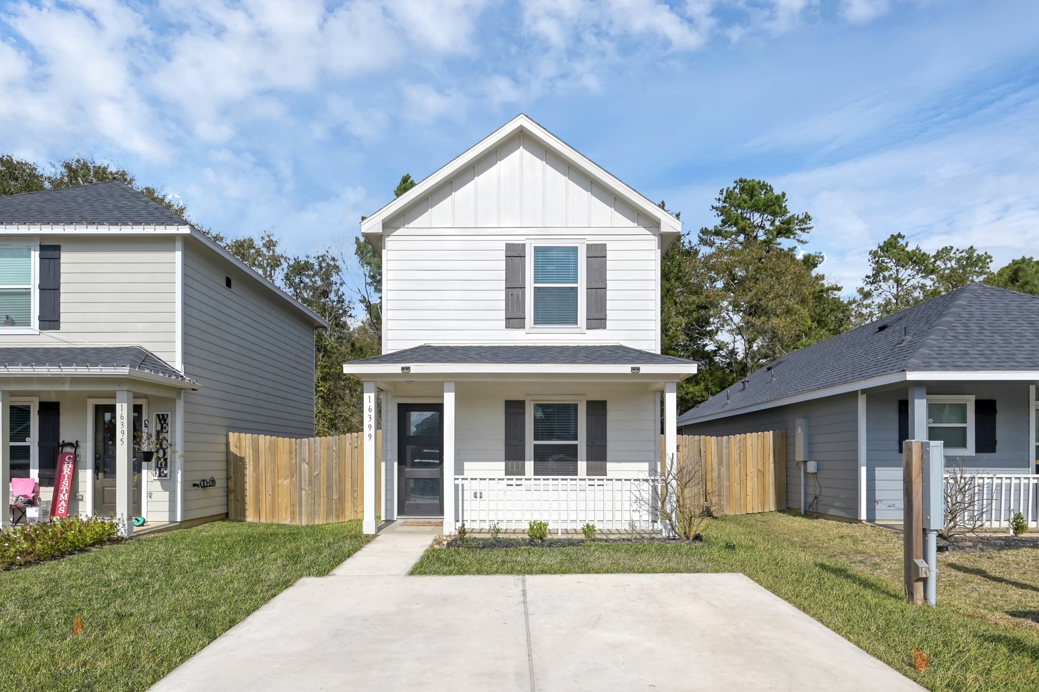 16399 Jasmine Marie Place Conroe, TX 77306 - Photo 2 of 22 a front view of a house with a yard
