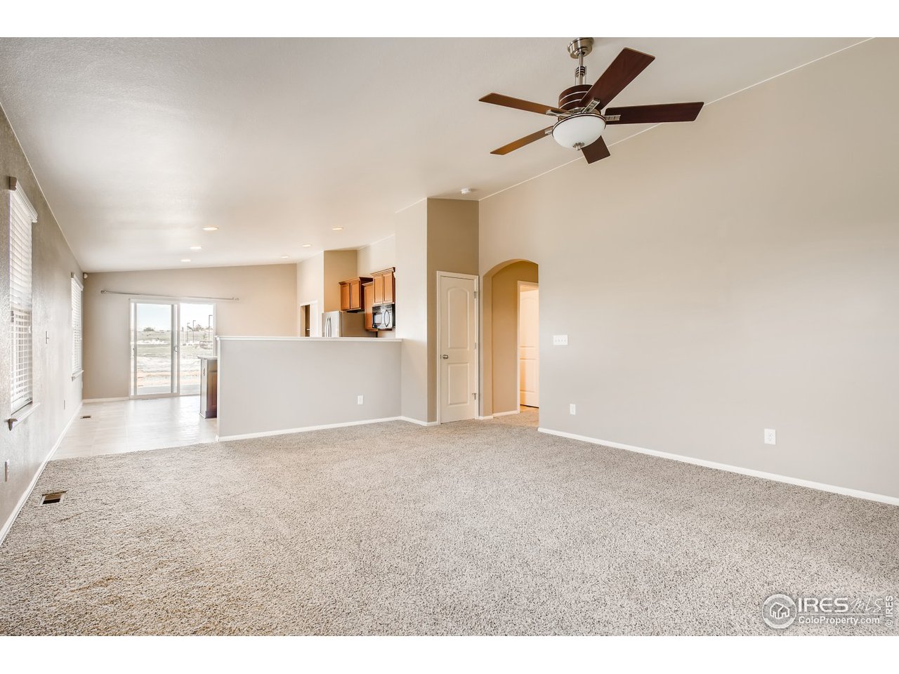 8663 Raspberry Drive Frederick, CO 80504 - Photo 11 of 33 a view of a livingroom with a ceiling fan and window
