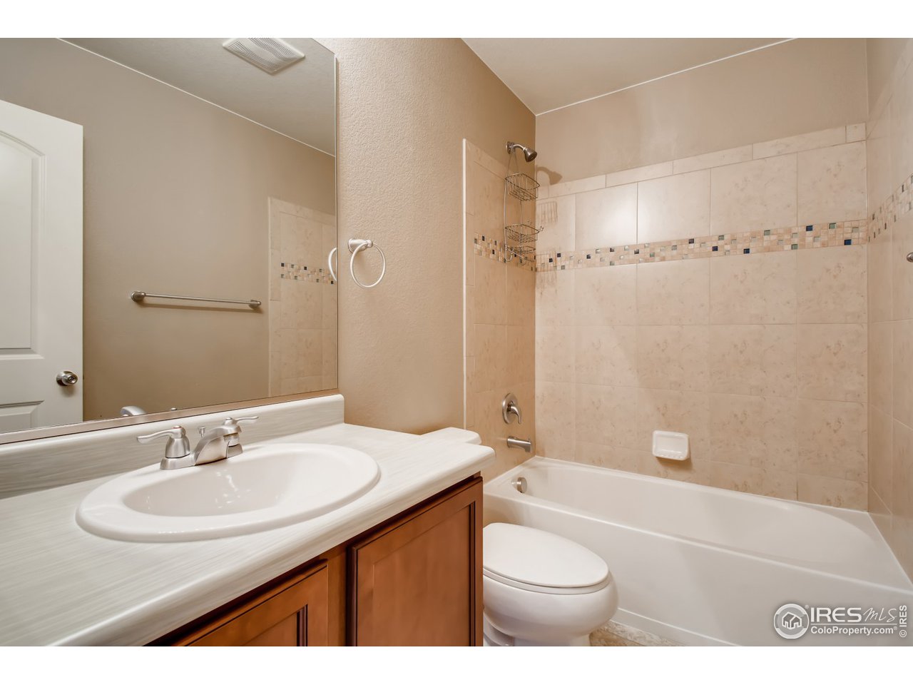 8663 Raspberry Drive Frederick, CO 80504 - Photo 25 of 33 a bathroom with a sink a toilet and shower