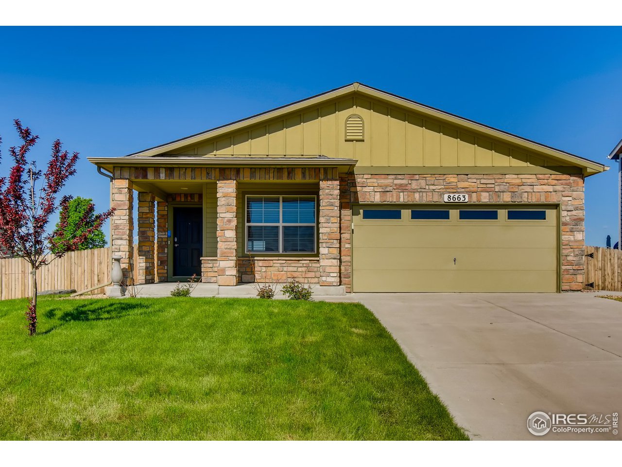 8663 Raspberry Drive Frederick, CO 80504 - Photo 3 of 33 a front view of a house with a yard