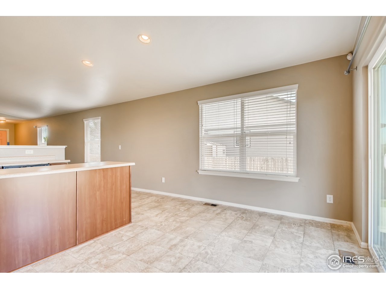8663 Raspberry Drive Frederick, CO 80504 - Photo 9 of 33 a view of a kitchen with furniture and a window