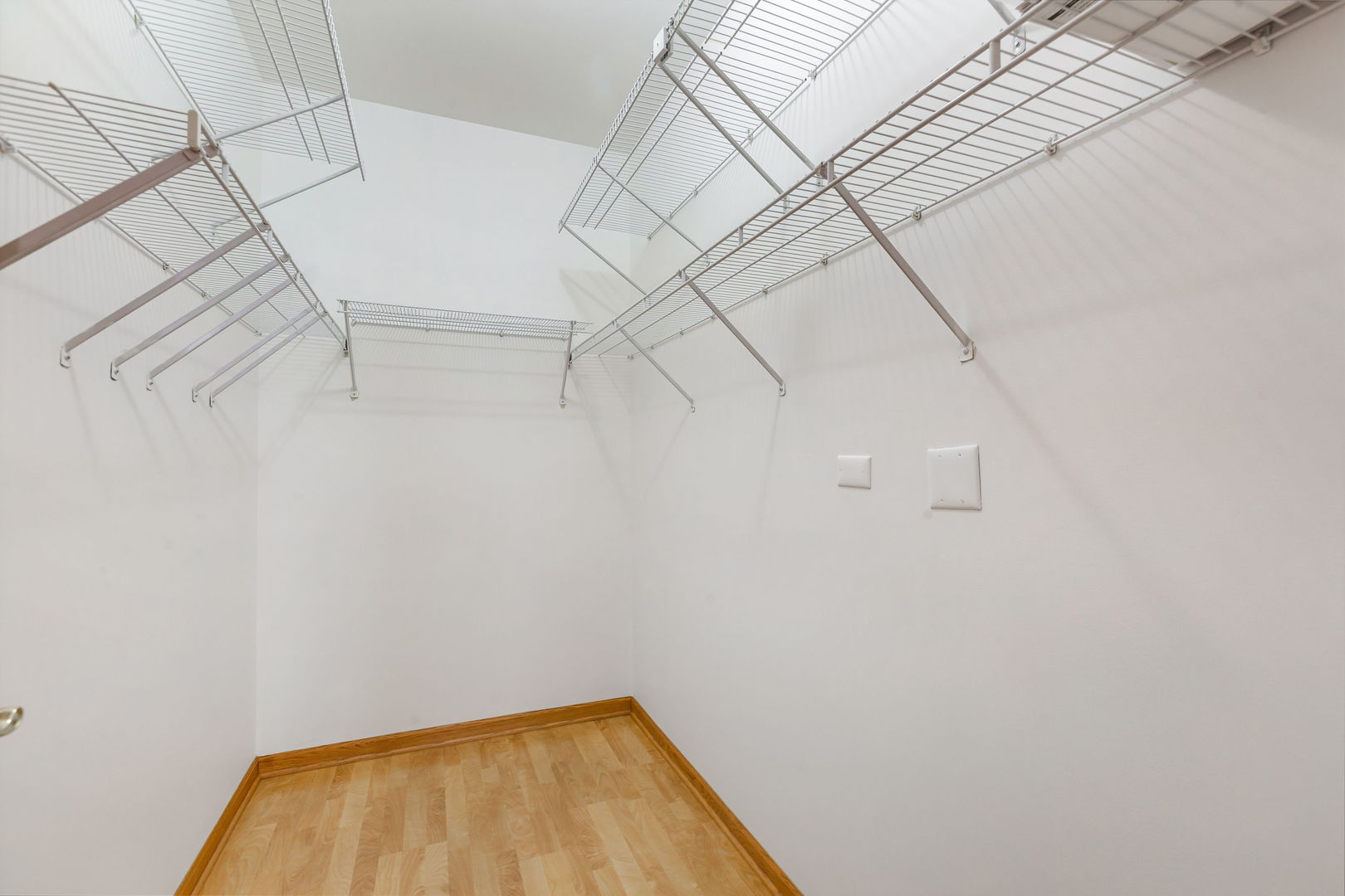 1259 West Lake Street, Unit 203 Addison, IL 60101 - Photo 11 of 17 a view of a room with racks on the wall