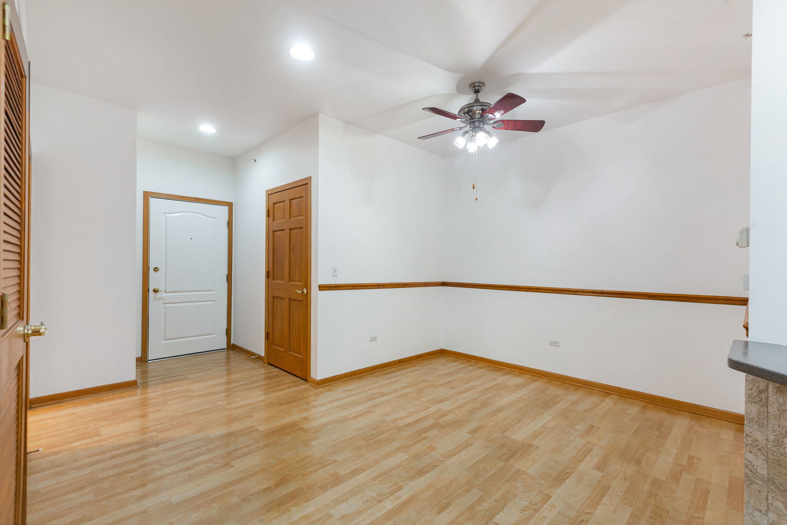 1259 West Lake Street, Unit 203 Addison, IL 60101 - Photo 2 of 17 wooden floor in an empty room