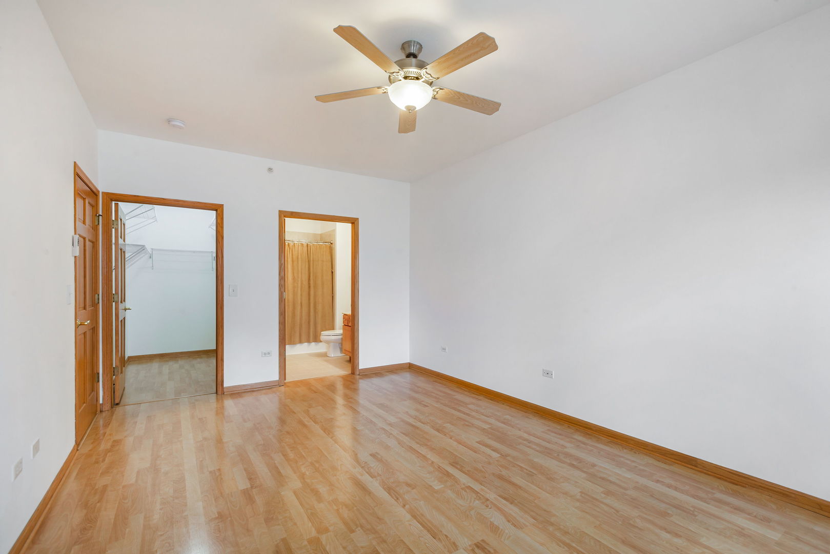 1259 West Lake Street, Unit 203 Addison, IL 60101 - Photo 10 of 17 a view of an empty room with wooden floor