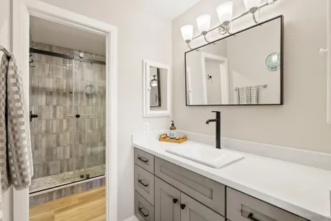 a bathroom with a sink and a mirror