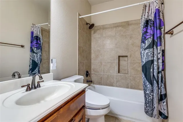 a bathroom with a sink a toilet and a bathtub