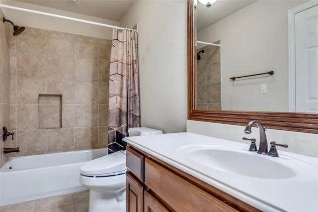 a bathroom with a sink a toilet and a bathtub