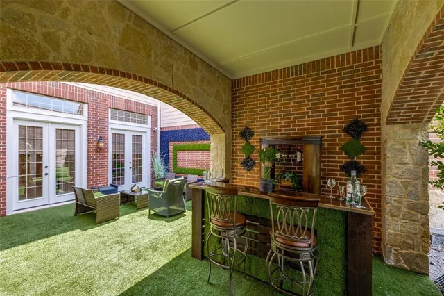a view of house with a chairs and table in patio