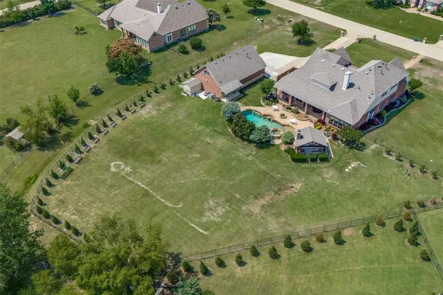an aerial view of residential house with outdoor space