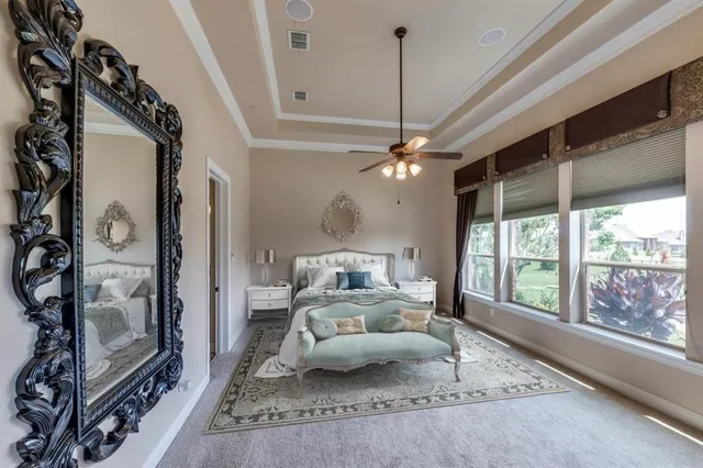 a bedroom with furniture and a chandelier