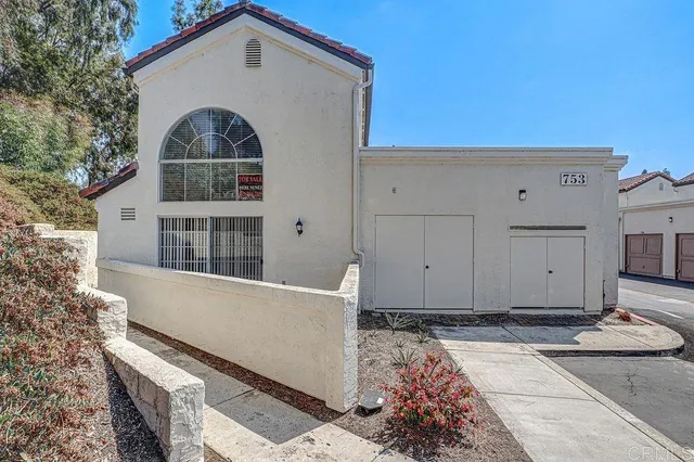 a view of a house with a street