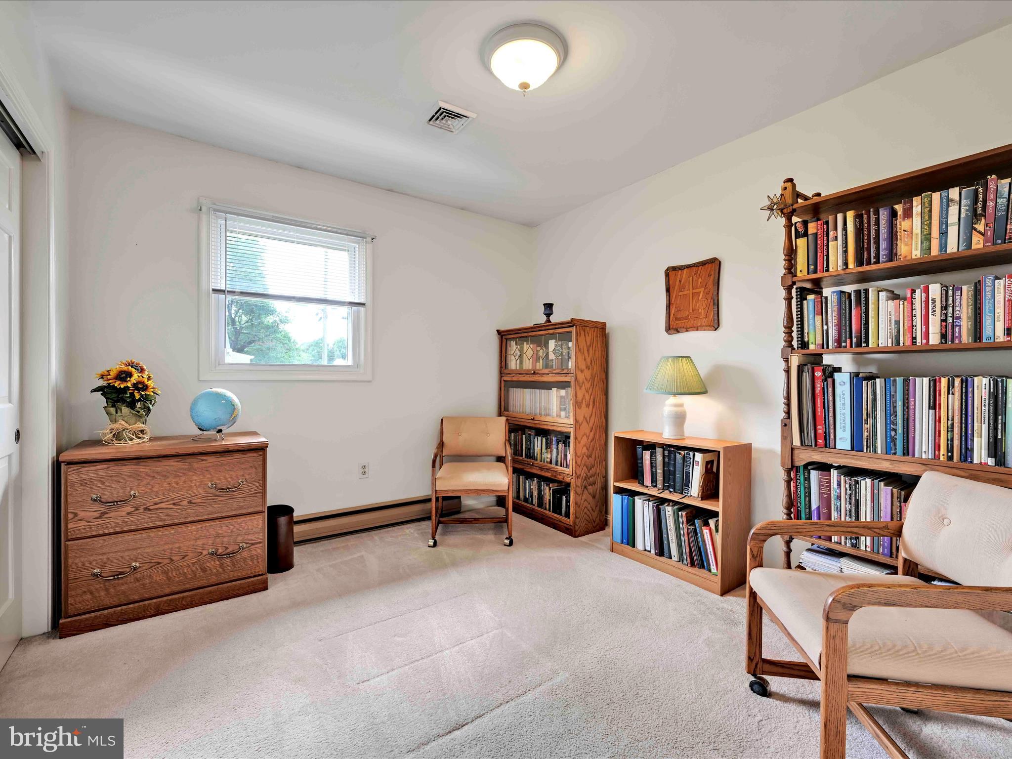 301 Owl Hill Road Lititz, PA 17543 - Photo 16 of 35 a living room with furniture and a book shelf