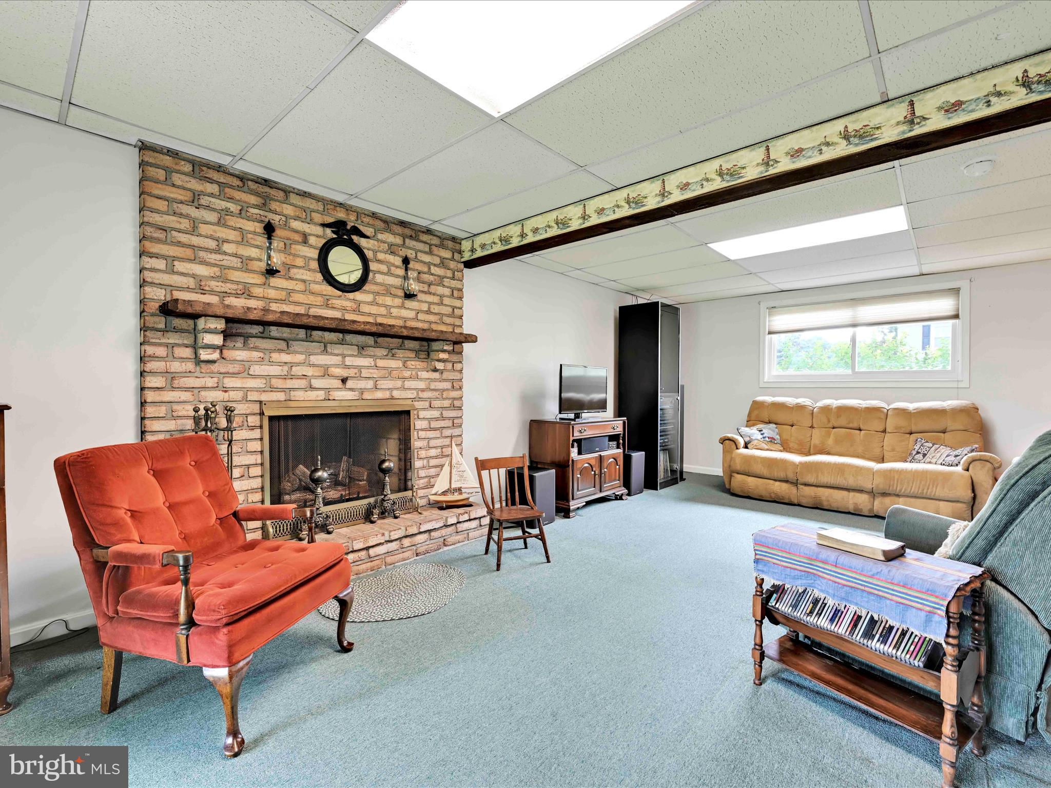 301 Owl Hill Road Lititz, PA 17543 - Photo 19 of 35 a living room with furniture and a fireplace