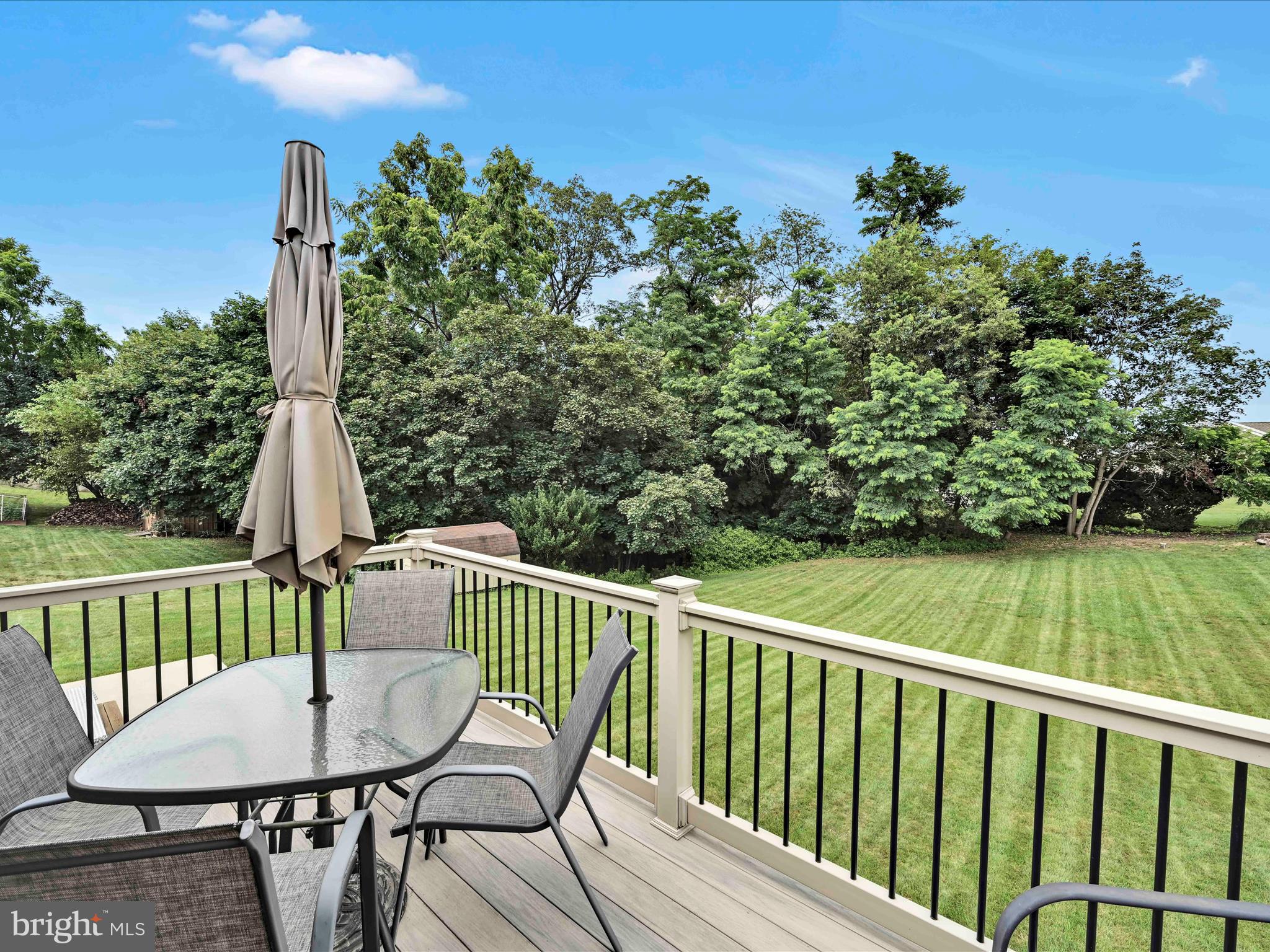 301 Owl Hill Road Lititz, PA 17543 - Photo 22 of 35 a view of a deck with a chair and floor to ceiling window