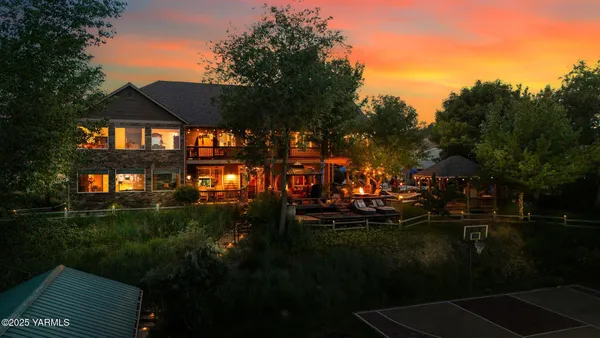 a view of a backyard with sitting area
