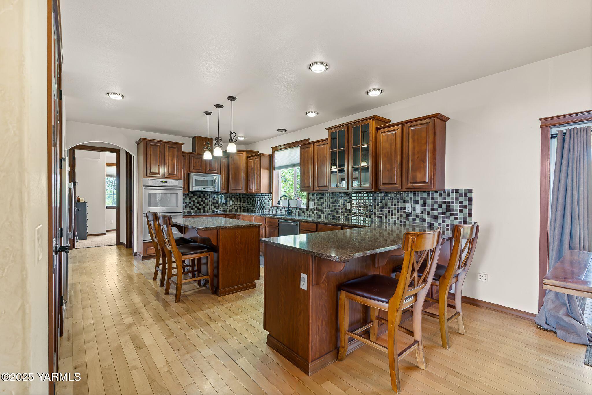 12900 Douglas Road Yakima, WA 98908 - Photo 17 of 62 a dining room with furniture and wooden floor