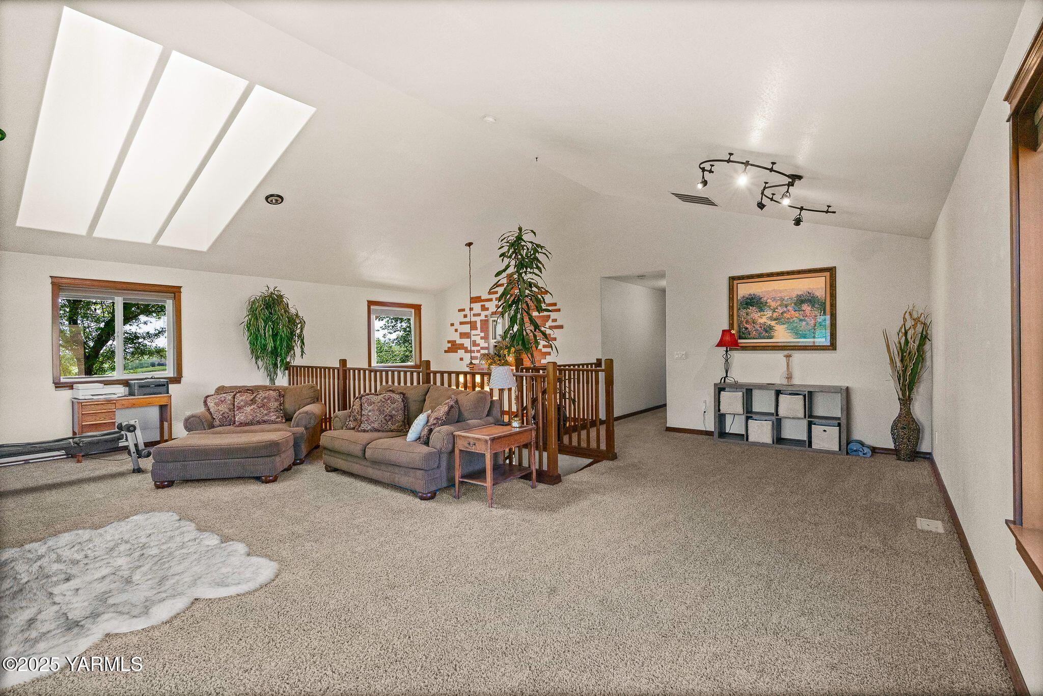 12900 Douglas Road Yakima, WA 98908 - Photo 32 of 62 a living room with furniture and a chandelier