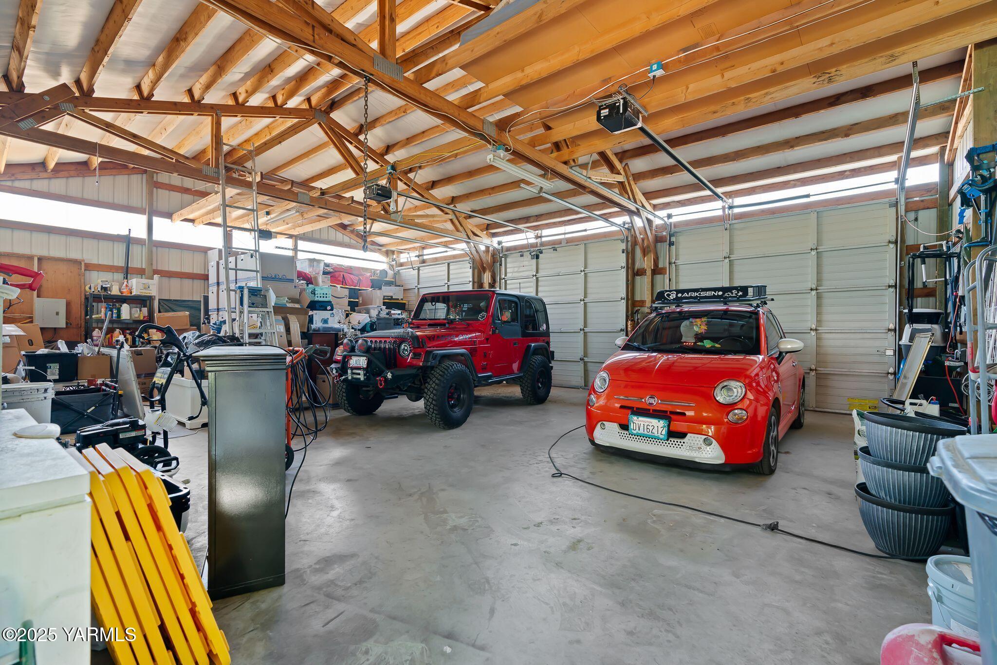 12900 Douglas Road Yakima, WA 98908 - Photo 39 of 62 a garage with a car parked car