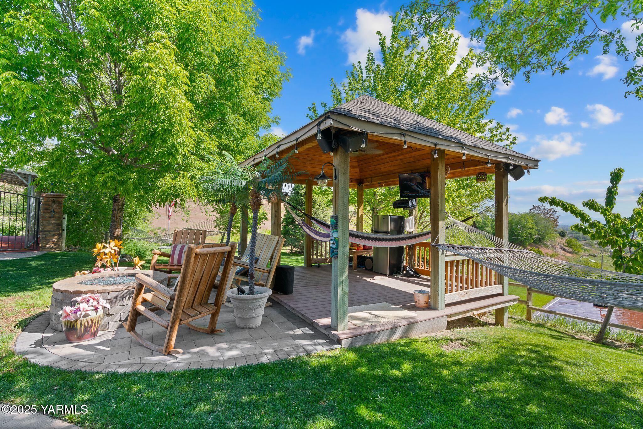 12900 Douglas Road Yakima, WA 98908 - Photo 51 of 62 a view of a chair and table in backyard of the house