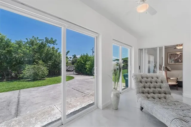 a view of a patio with couches and potted plants