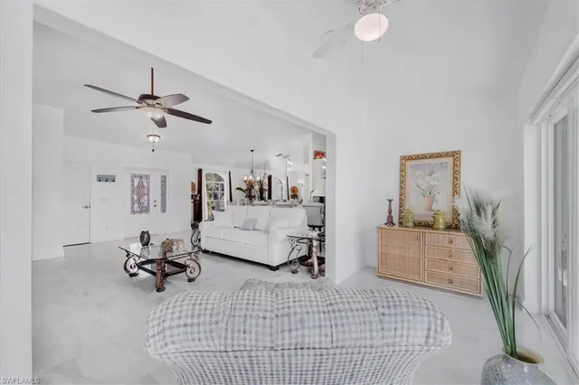 a bed sitting in a bedroom next to a lamp