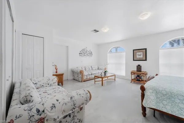 a bedroom with furniture and a table