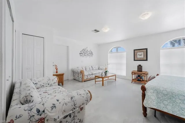 a bedroom with furniture and a table