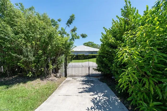 an aerial view of multiple houses with yard