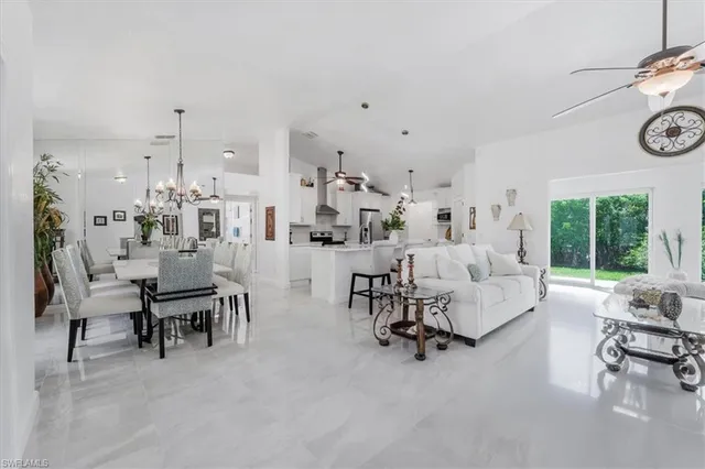 a living room with furniture and a clock