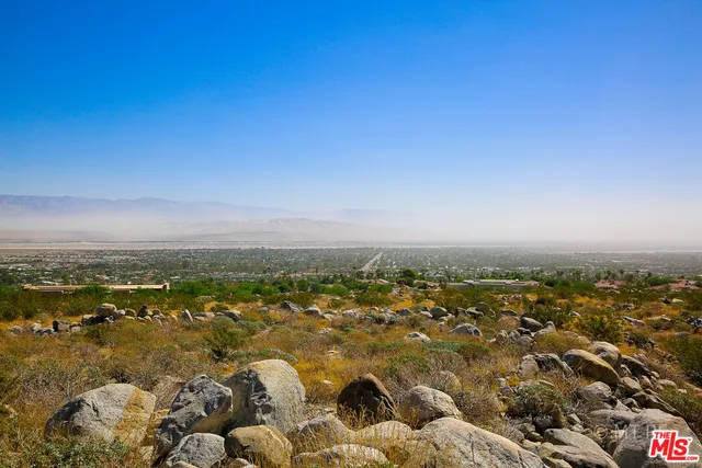 a view of a road with a mountain in the background
