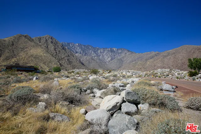 an aerial view of multiple house with yard