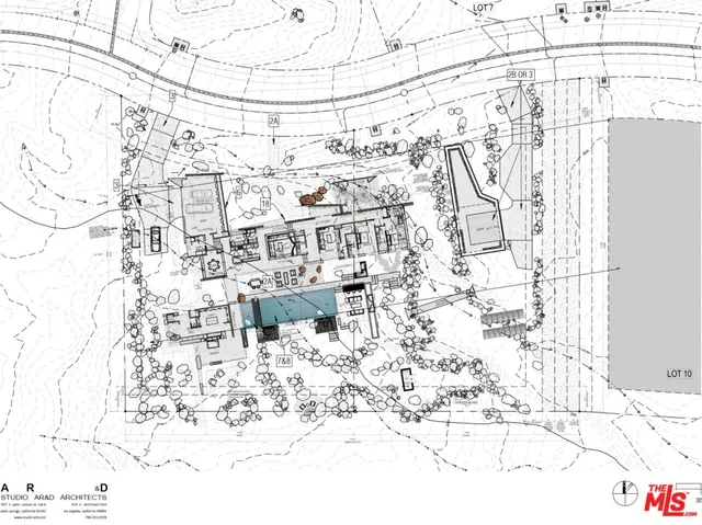 a bathroom with a sink mirror and vanity