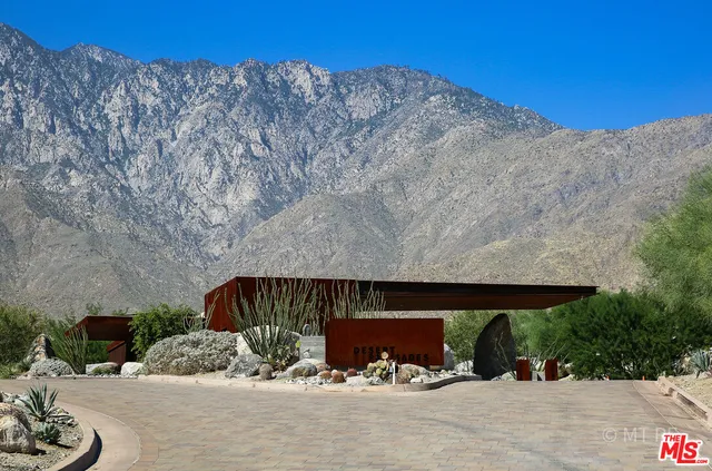 a view of a road with mountains in the background