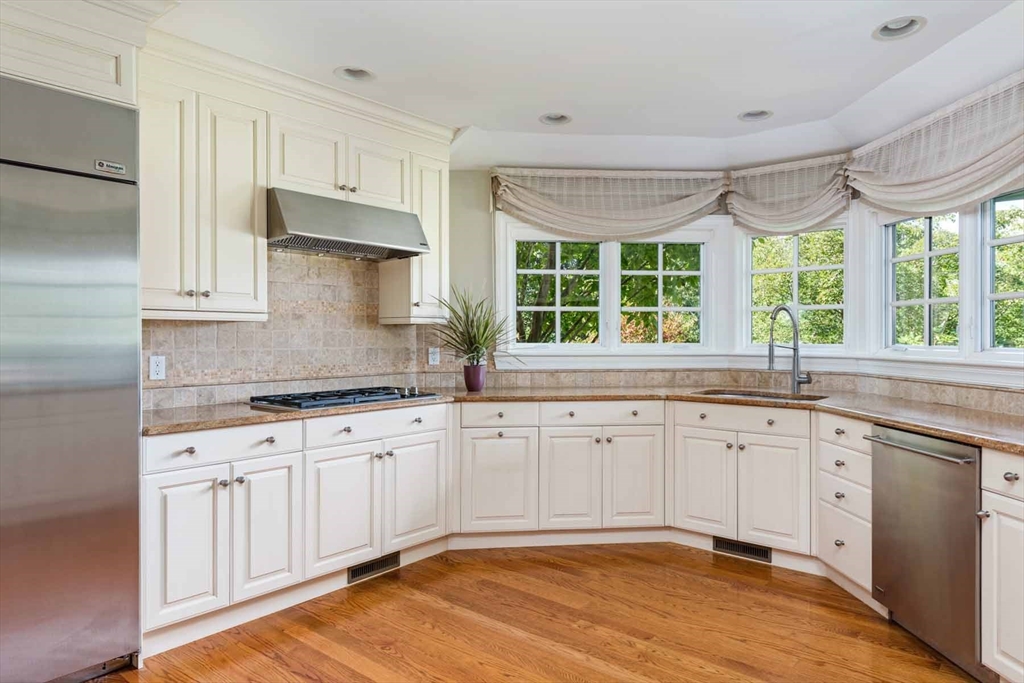 2 Open Drive Sandwich, MA 02563 - Photo 13 of 34 a kitchen with granite countertop a sink stainless steel appliances cabinets and a large window