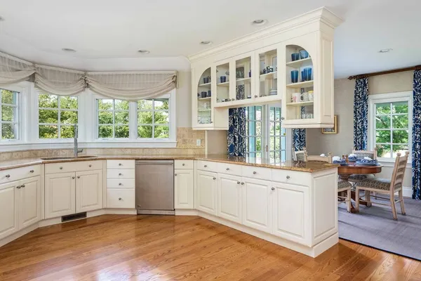 a kitchen with a stove a sink and a refrigerator