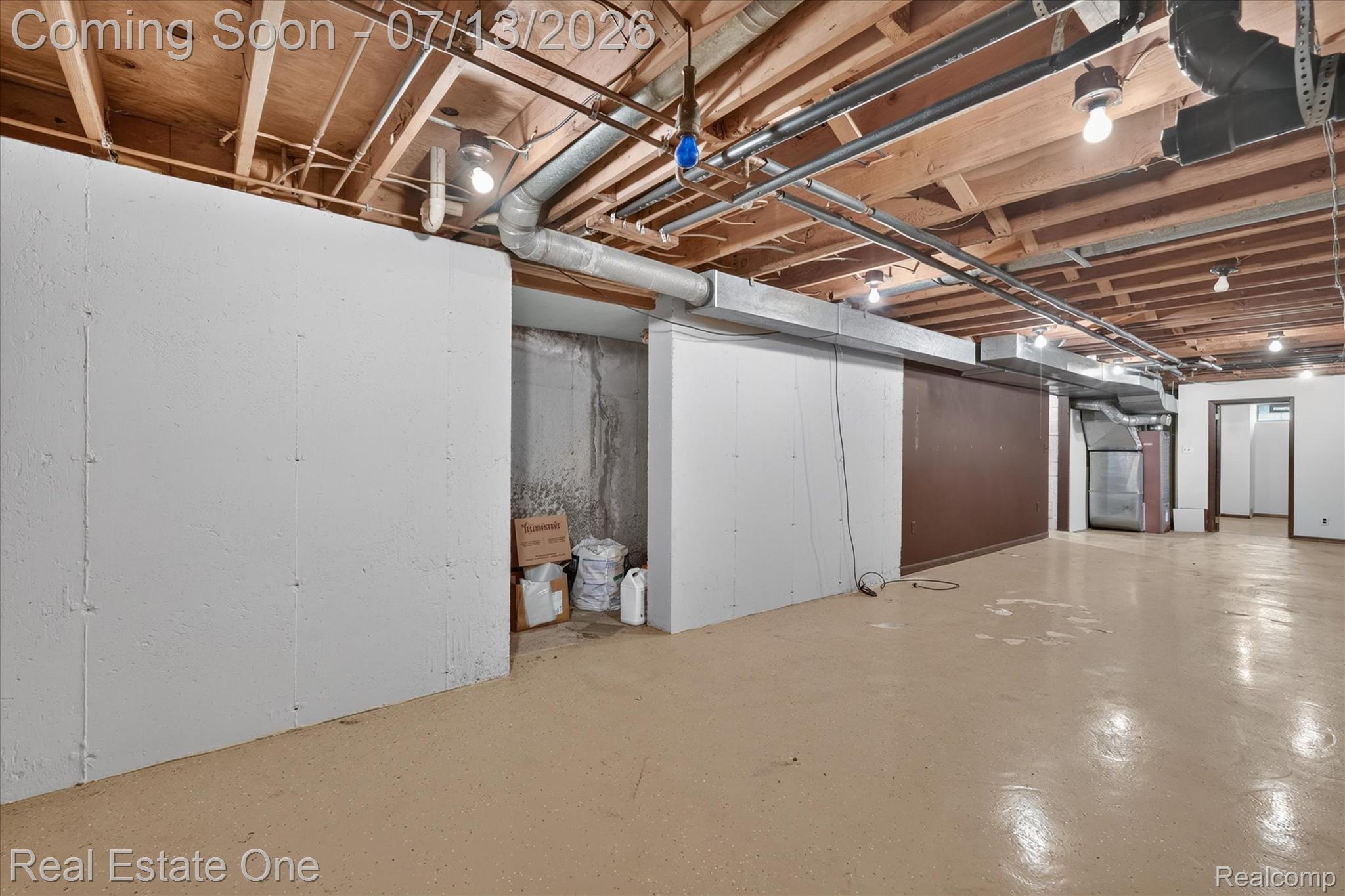 6039 Fish Lake Road Holly, MI 48442 - Photo 40 of 70 Spacious partially finished basement area with epoxy flooring.