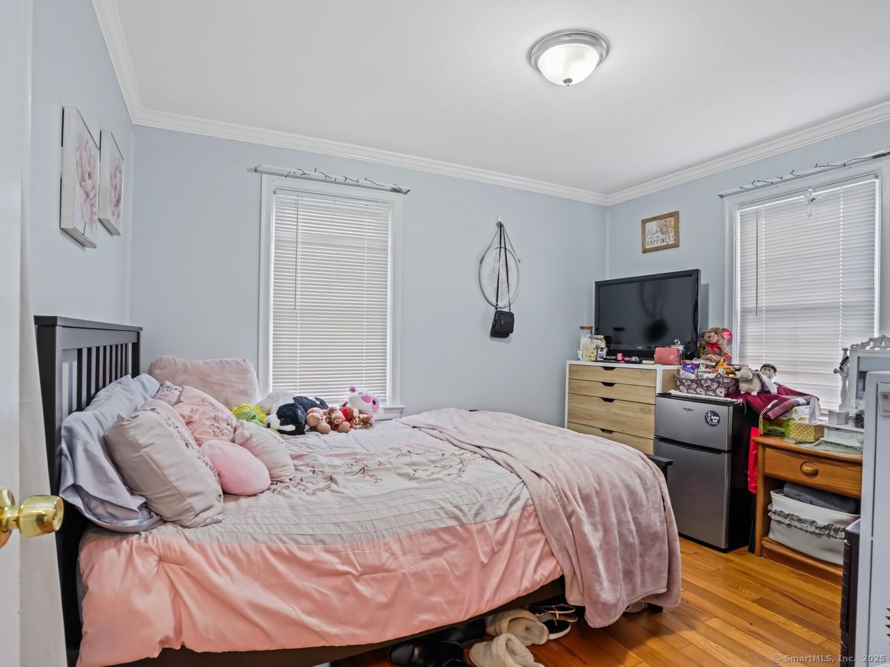 375 Ruth Street Bridgeport, CT 06606 - Photo 11 of 27 a bedroom with a bed and flat screen tv