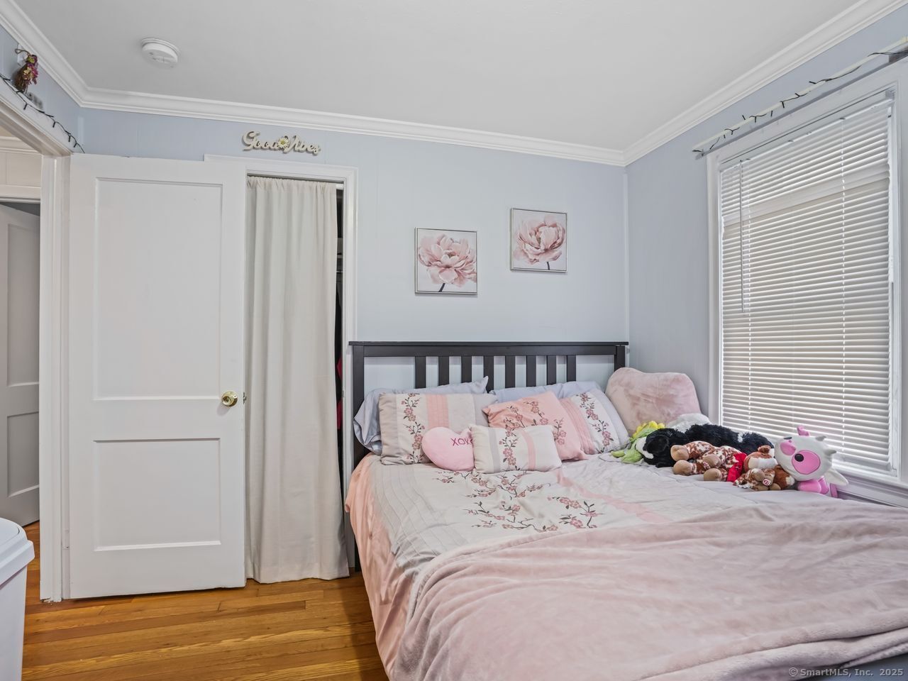 375 Ruth Street Bridgeport, CT 06606 - Photo 12 of 27 a bedroom with a bed and wooden floor
