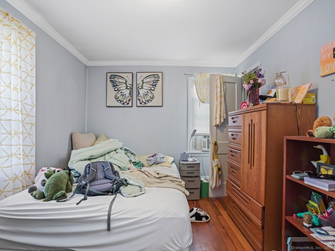 375 Ruth Street Bridgeport, CT 06606 - Photo 14 of 27 a bedroom with a bed and a window