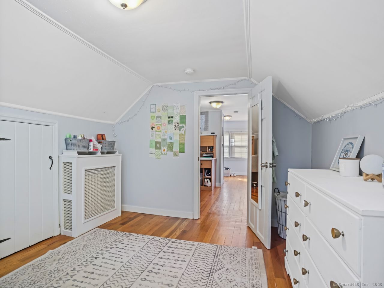 375 Ruth Street Bridgeport, CT 06606 - Photo 18 of 27 a bedroom with a bed and wooden floor