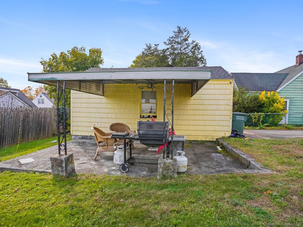 375 Ruth Street Bridgeport, CT 06606 - Photo 25 of 27 a backyard of a house with table and chairs