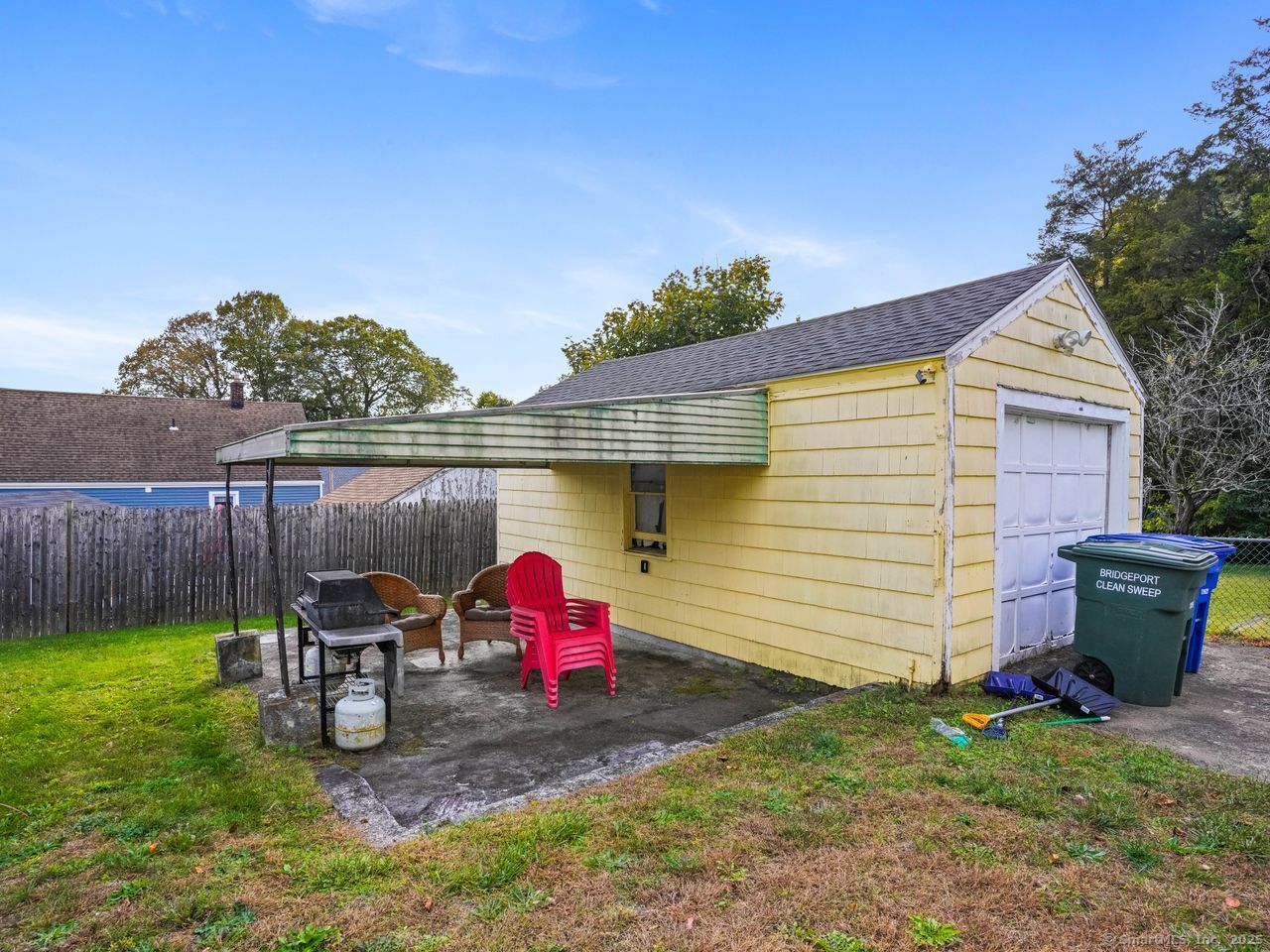 375 Ruth Street Bridgeport, CT 06606 - Photo 26 of 27 a view of a chair and table in backyard of the house