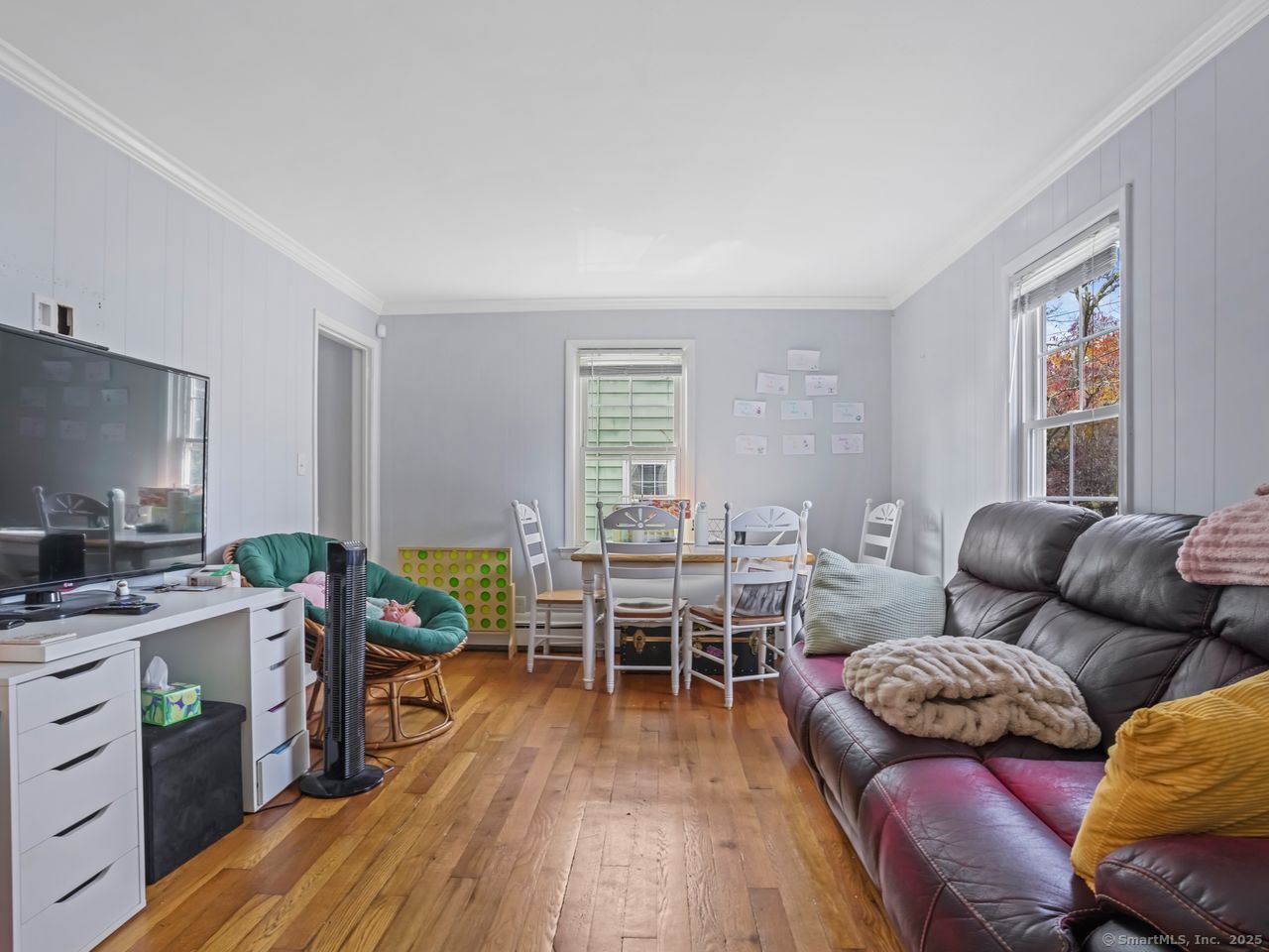 375 Ruth Street Bridgeport, CT 06606 - Photo 4 of 27 a living room with furniture and a wooden floor