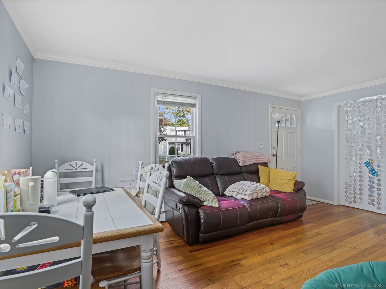375 Ruth Street Bridgeport, CT 06606 - Photo 6 of 27 a living room with furniture and a wooden floor