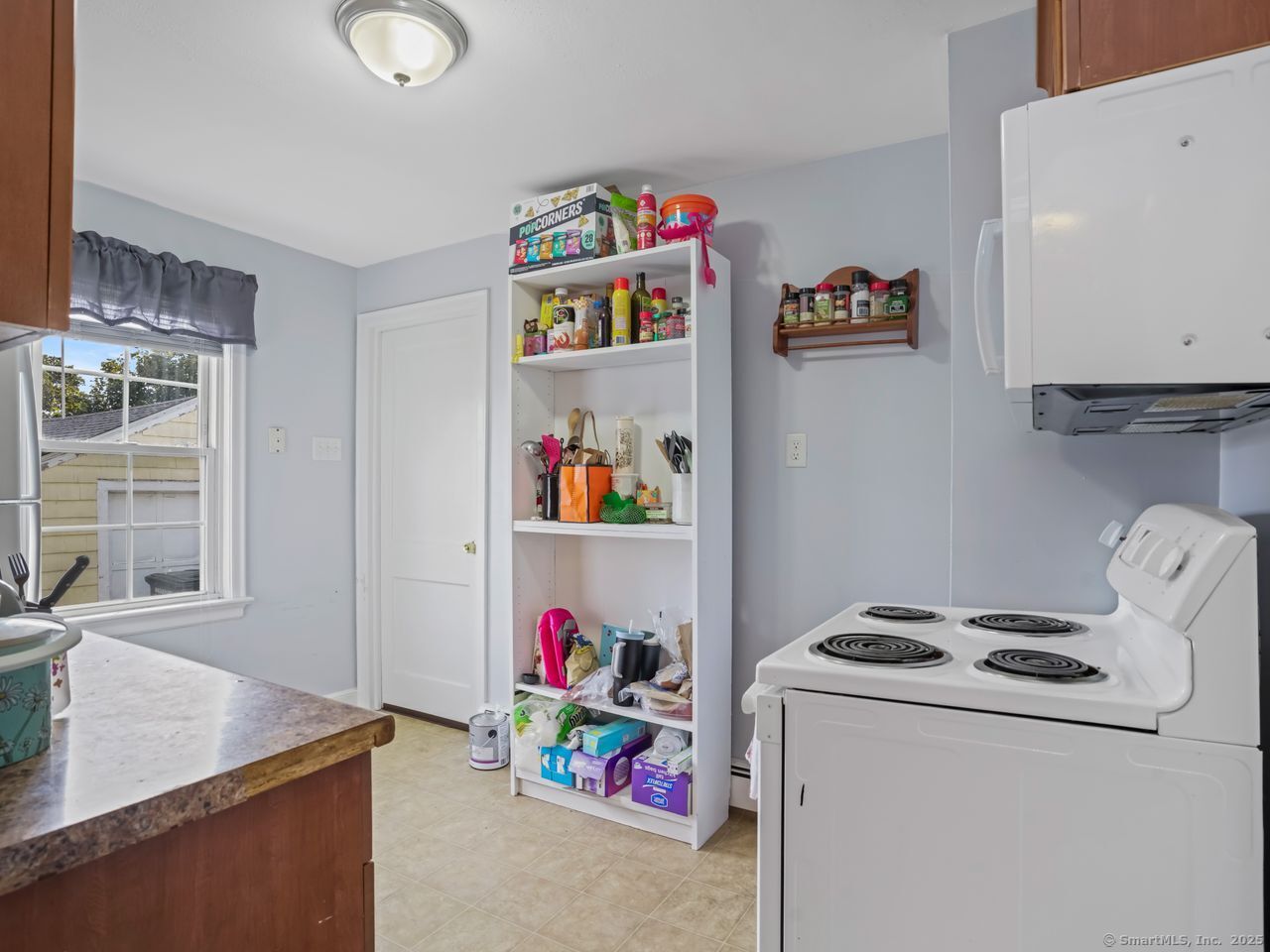 375 Ruth Street Bridgeport, CT 06606 - Photo 7 of 27 a storage room with washer and dryer