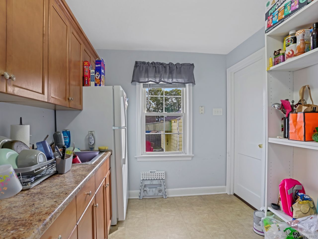 375 Ruth Street Bridgeport, CT 06606 - Photo 8 of 27 a kitchen with a refrigerator and sink