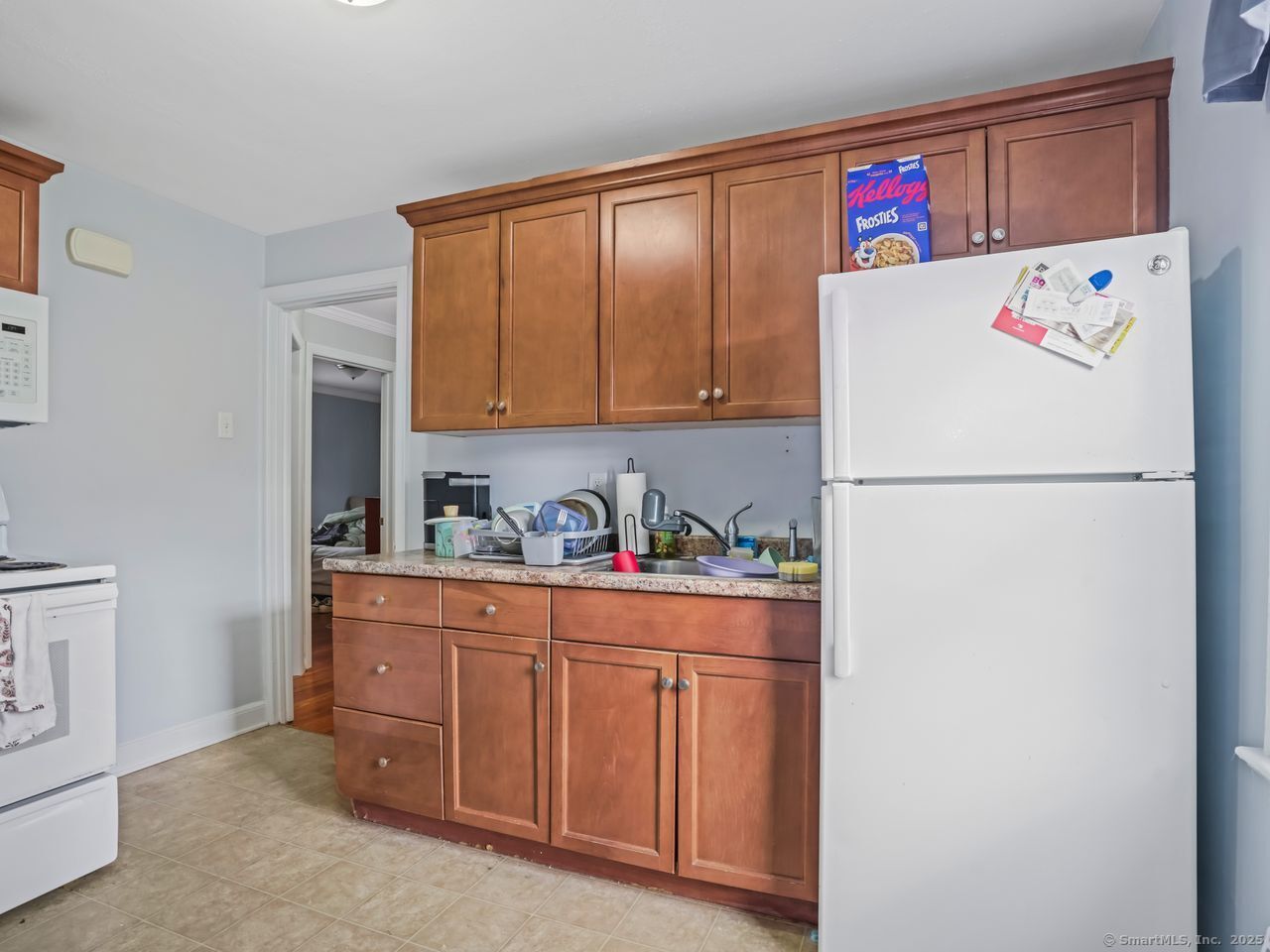 375 Ruth Street Bridgeport, CT 06606 - Photo 9 of 27 a white refrigerator freezer sitting inside of a kitchen